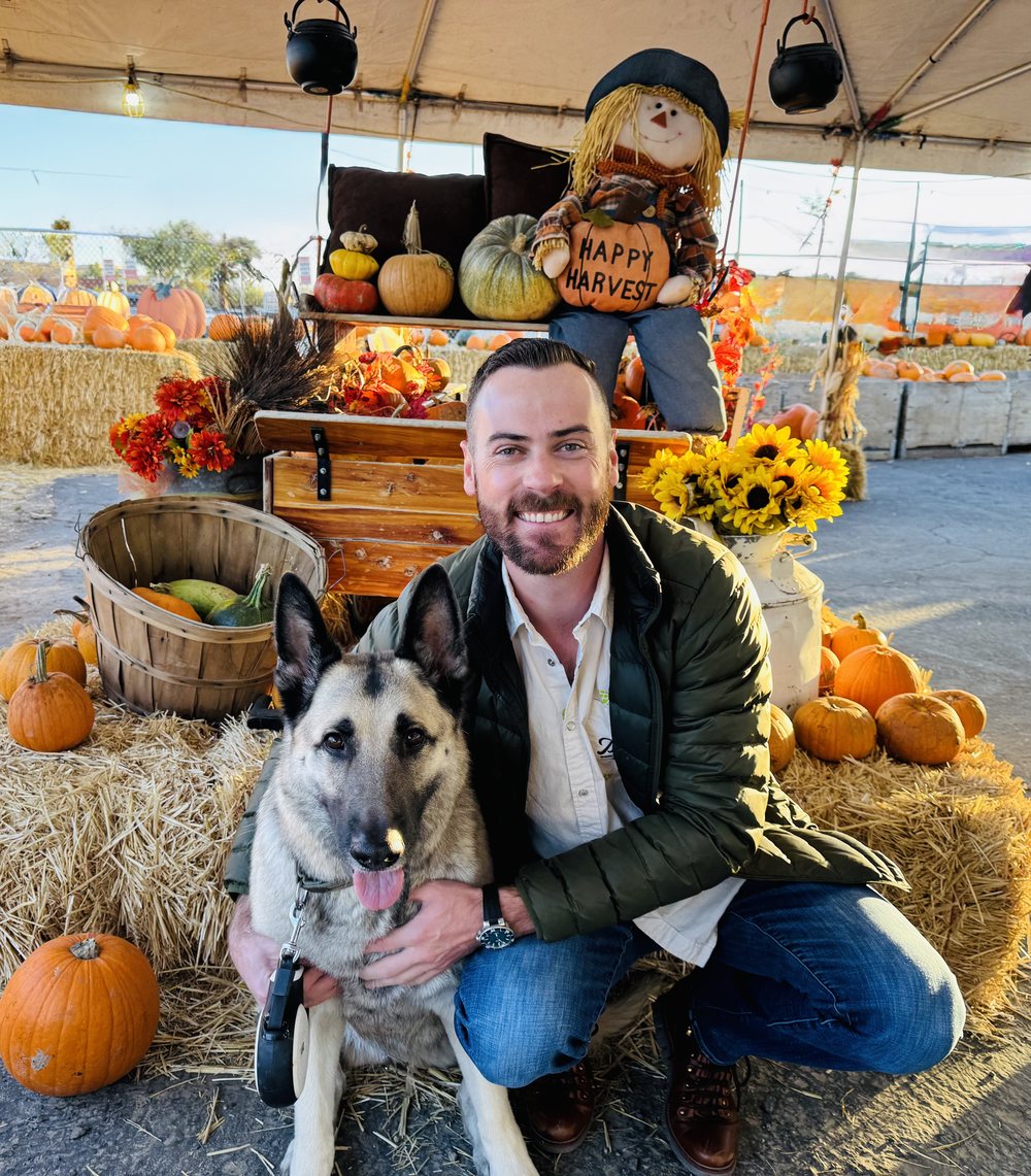 Kyle Nielsen and his German Shepherd at a local pumpkin patch